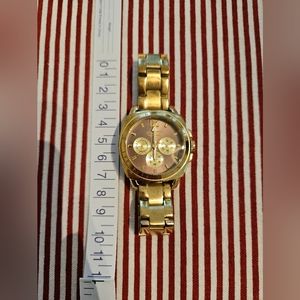 Coach Stainless Steel Watch in Color Gold. Sized to fit 15/16cm wrist. See pics